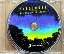 a cd case with a picture of trees and the words passenger all the