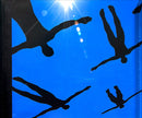 a picture of a blue sky with black silhouettes of people