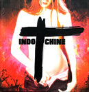 a woman standing in front of a cross