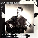 a black and white photo of a man holding a guitar