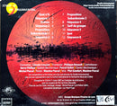 the back cover of a cd with a picture of a red disk
