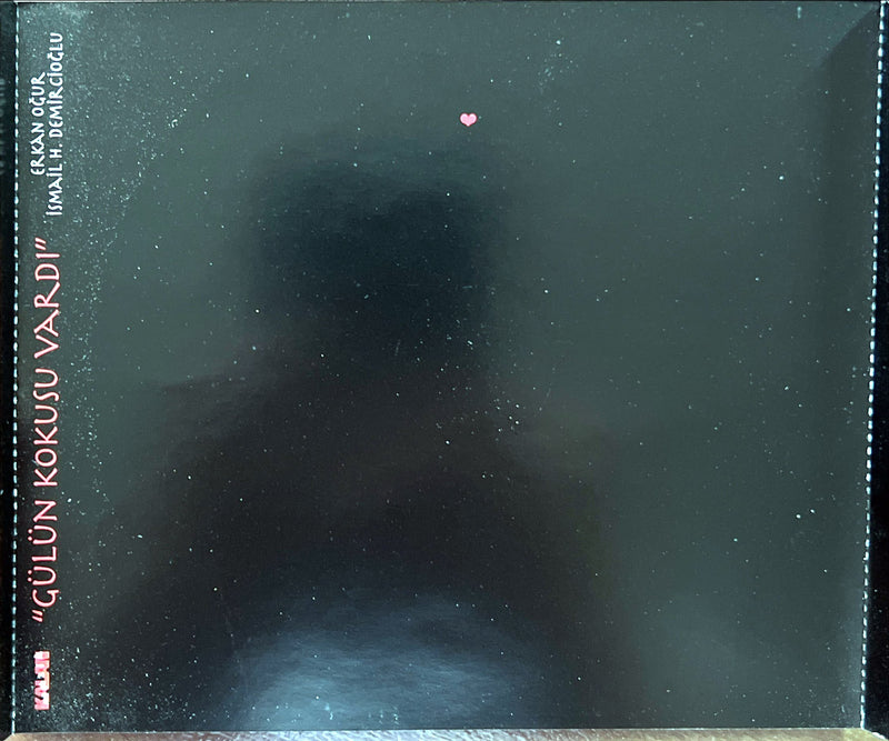 a blurry photo of a person's face in the dark