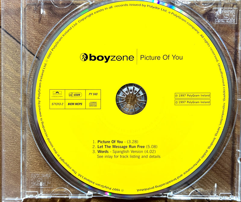 a cd case with a yellow label on it