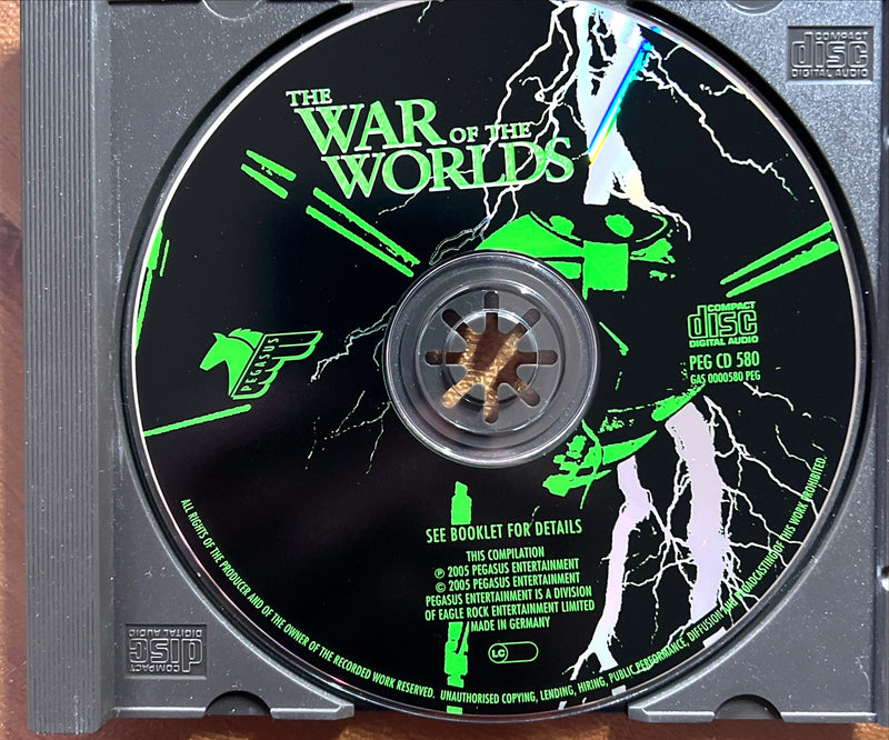 a cd that is sitting on a wooden surface
