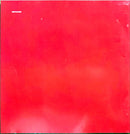 a red refrigerator freezer sitting on top of a counter