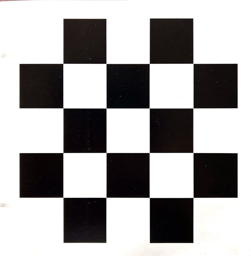 a black and white checkerboard pattern on a piece of paper