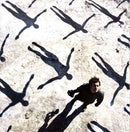 a man standing in the middle of a group of people