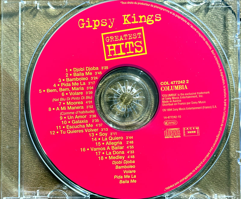 a cd with a pink disc label on it