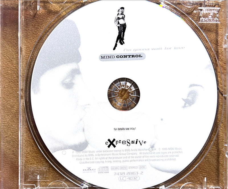 a cd with a picture of a woman kissing a man