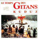 a magazine cover with a group of people sitting around a fire