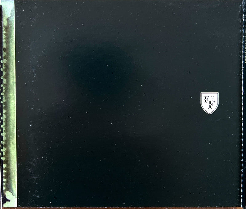 a close up of a black case with a white crest on it
