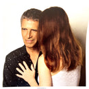 a man and a woman standing next to each other