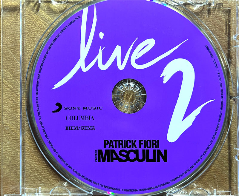 a purple disc with the words live 2 on it