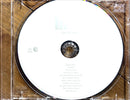 a cd case with a white disc inside of it