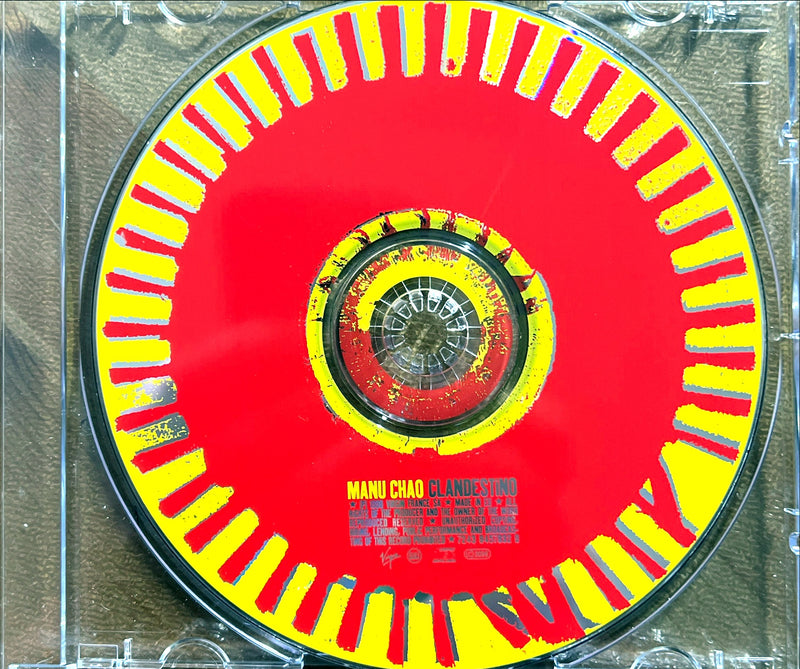 a red and yellow disc in a clear case