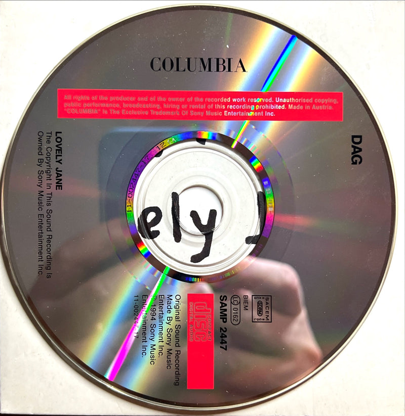 a cd with a picture of a hand holding a disc