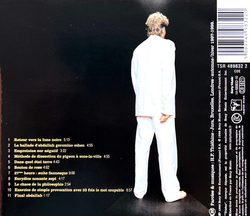 a back cover of a cd with a man in a white suit