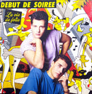 a couple of men sitting next to each other