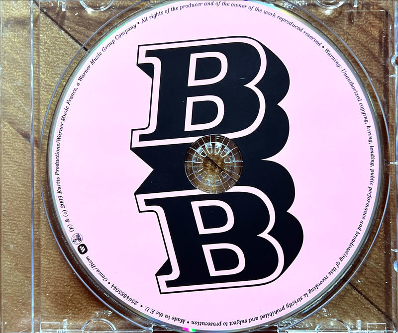 a cd with a black and white logo on it