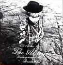 a black and white photo of a young boy wearing a hat