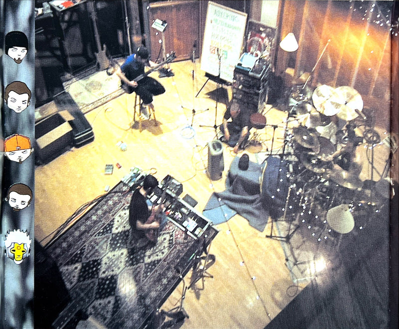 a group of people playing instruments in a room