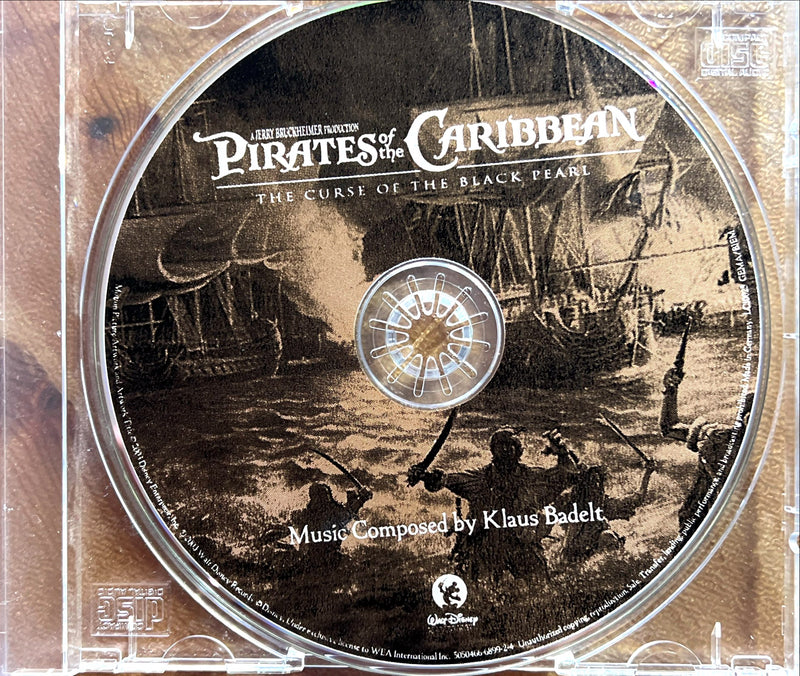 a cd with a picture of pirates of the caribbean on it