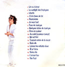 a man in a white suit and sunglasses standing in front of a white wall