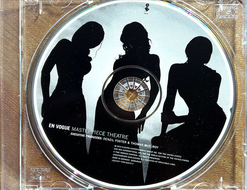 a cd with a picture of three women on it