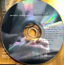 a cd sitting on top of a wooden table