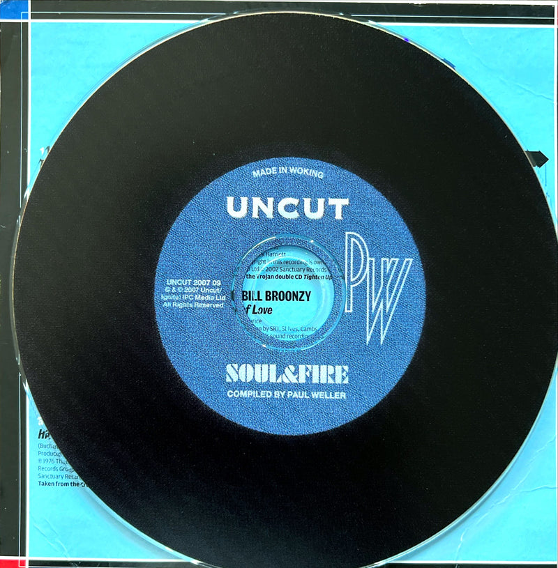 a black record with a blue label on it