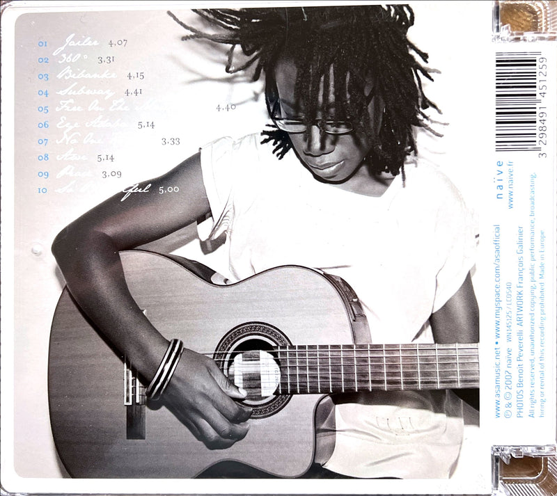 a man with dreadlocks playing a guitar