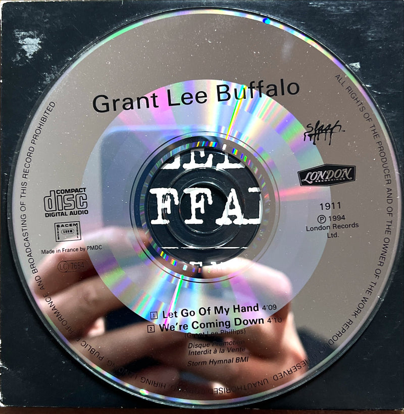 a person holding a cd in their hand