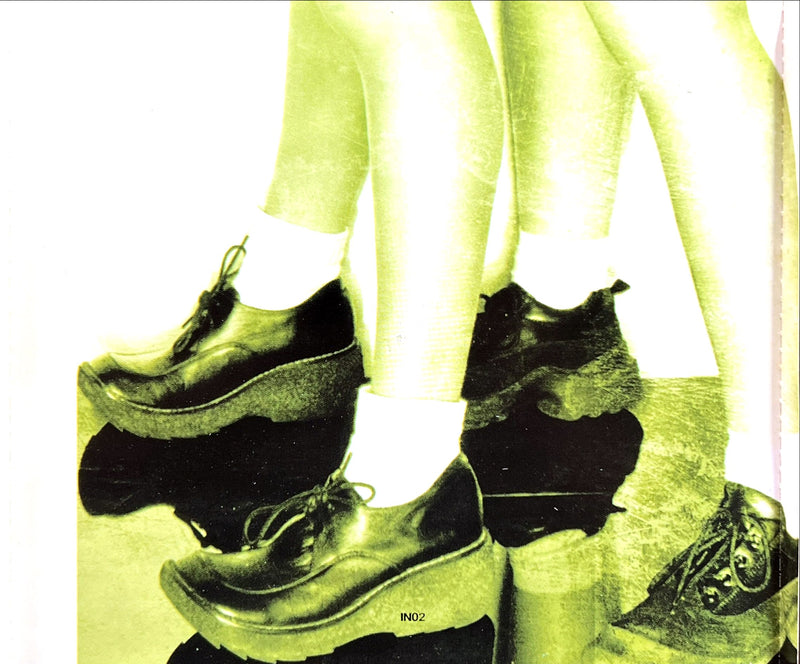 a pair of legs with shoes on top of them