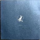 a blue book with a drawing of a man holding a tennis racket