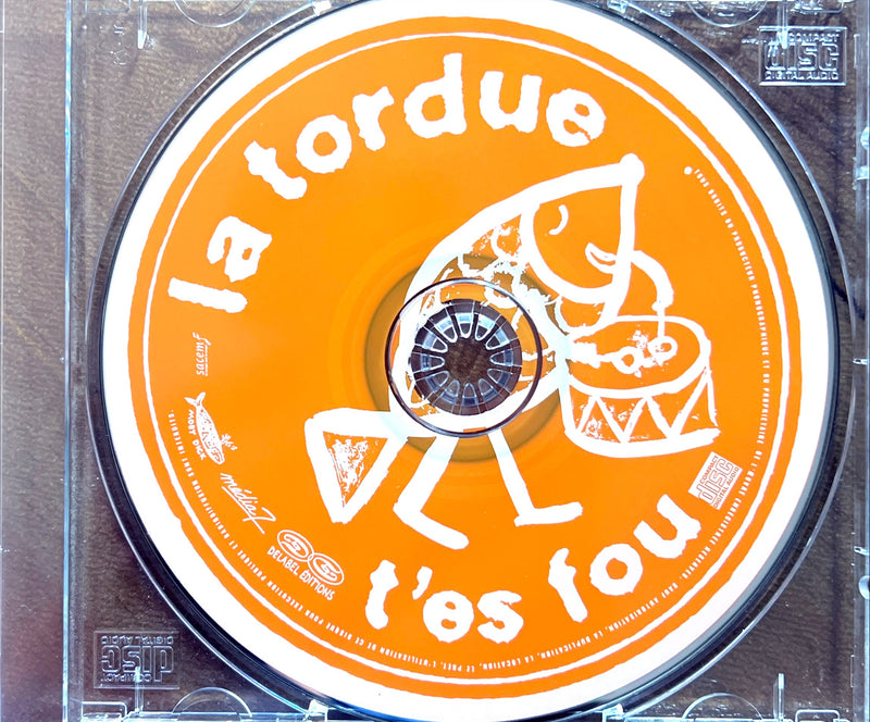 a cd with a picture of a man holding a guitar