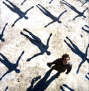 a man standing in the middle of a group of people