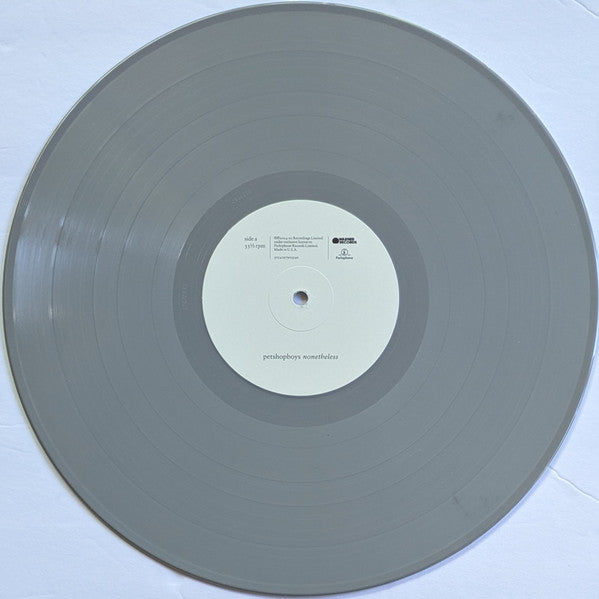 a white record on a white surface