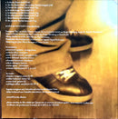 a close up of a pair of shoes on a wooden floor