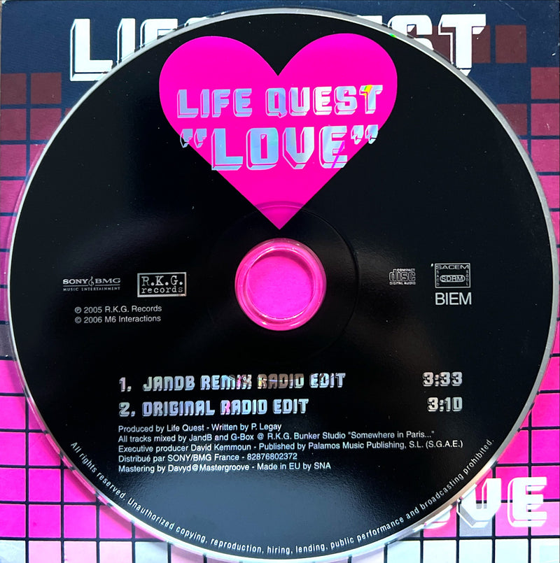 a cd disc with a pink heart on it