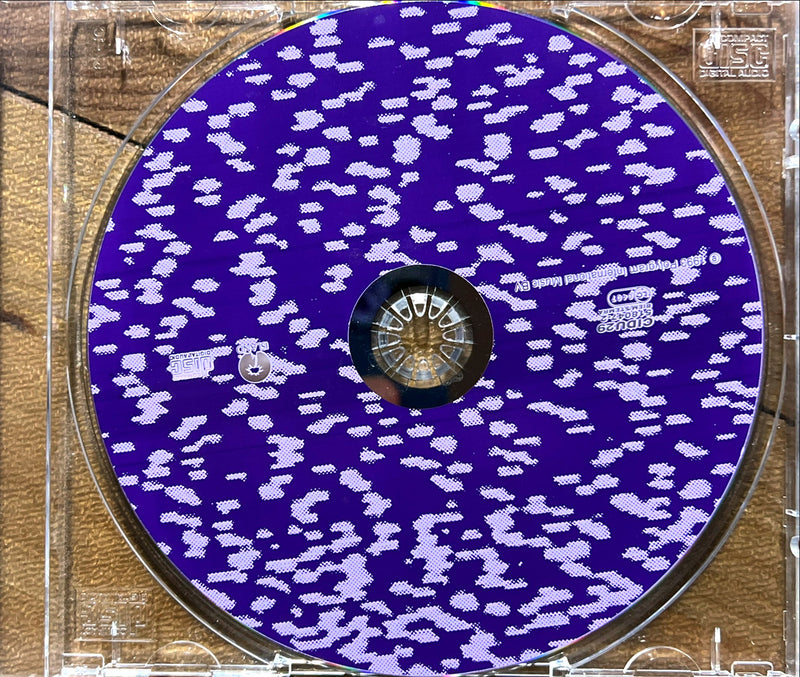 a cd case with a purple and white design on it