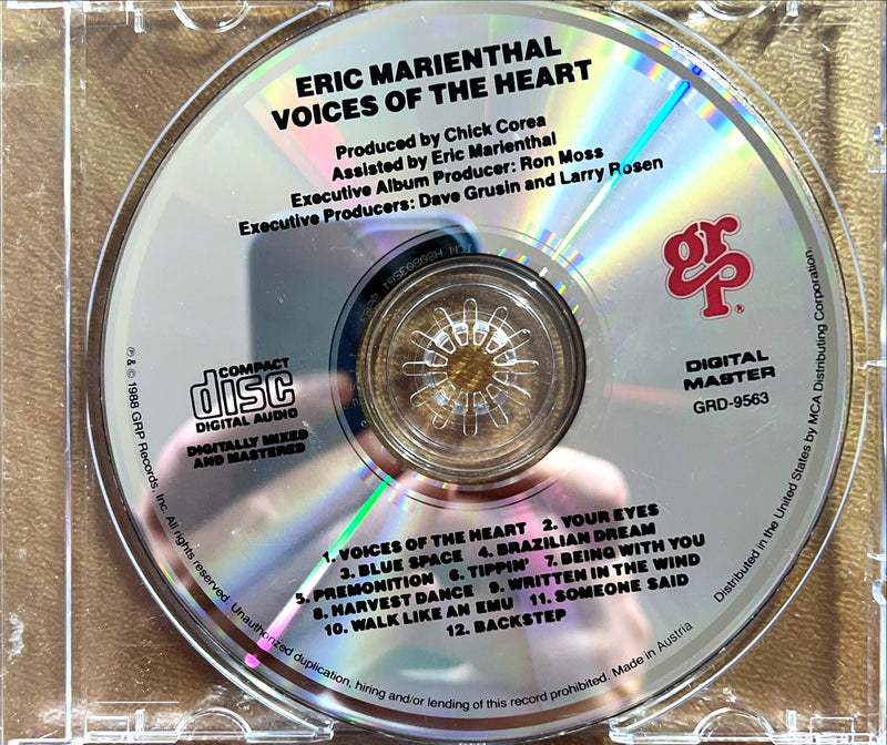 a cd with a picture of a person holding it
